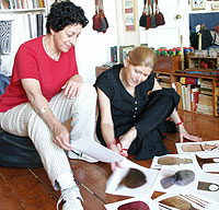 Ze'eva Cohen, director of Princeton's Advanced Dance Program, and Millicent Hodson studying archive costumes for the ballet